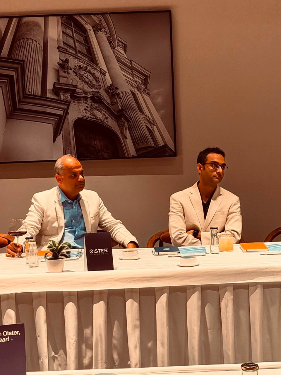 Rohit Bhayana and Himanshu Periwal of Oister Global seated at the panel table.